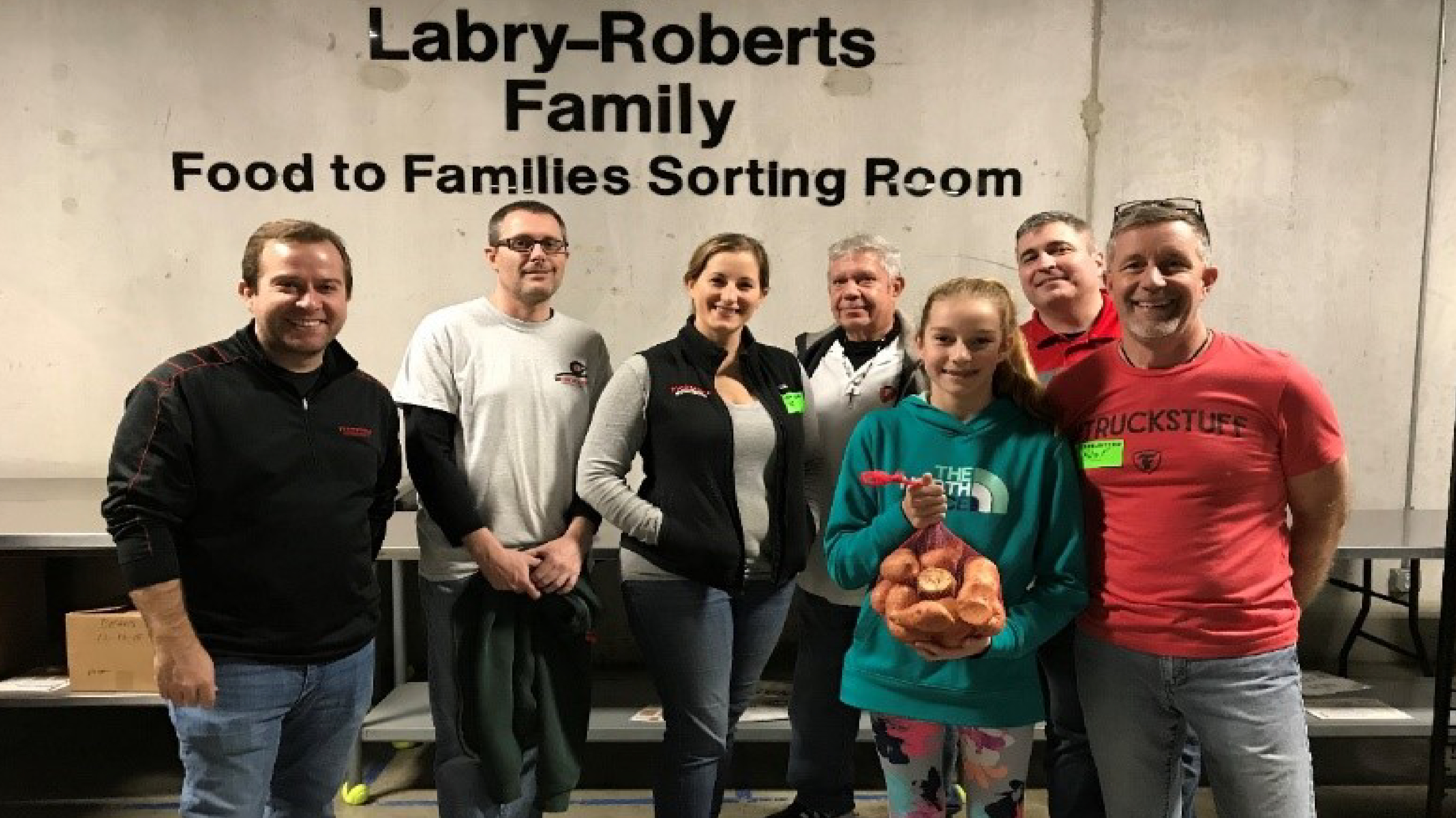 Firestone Building Products employees volunteering at Second harvest Food Bank